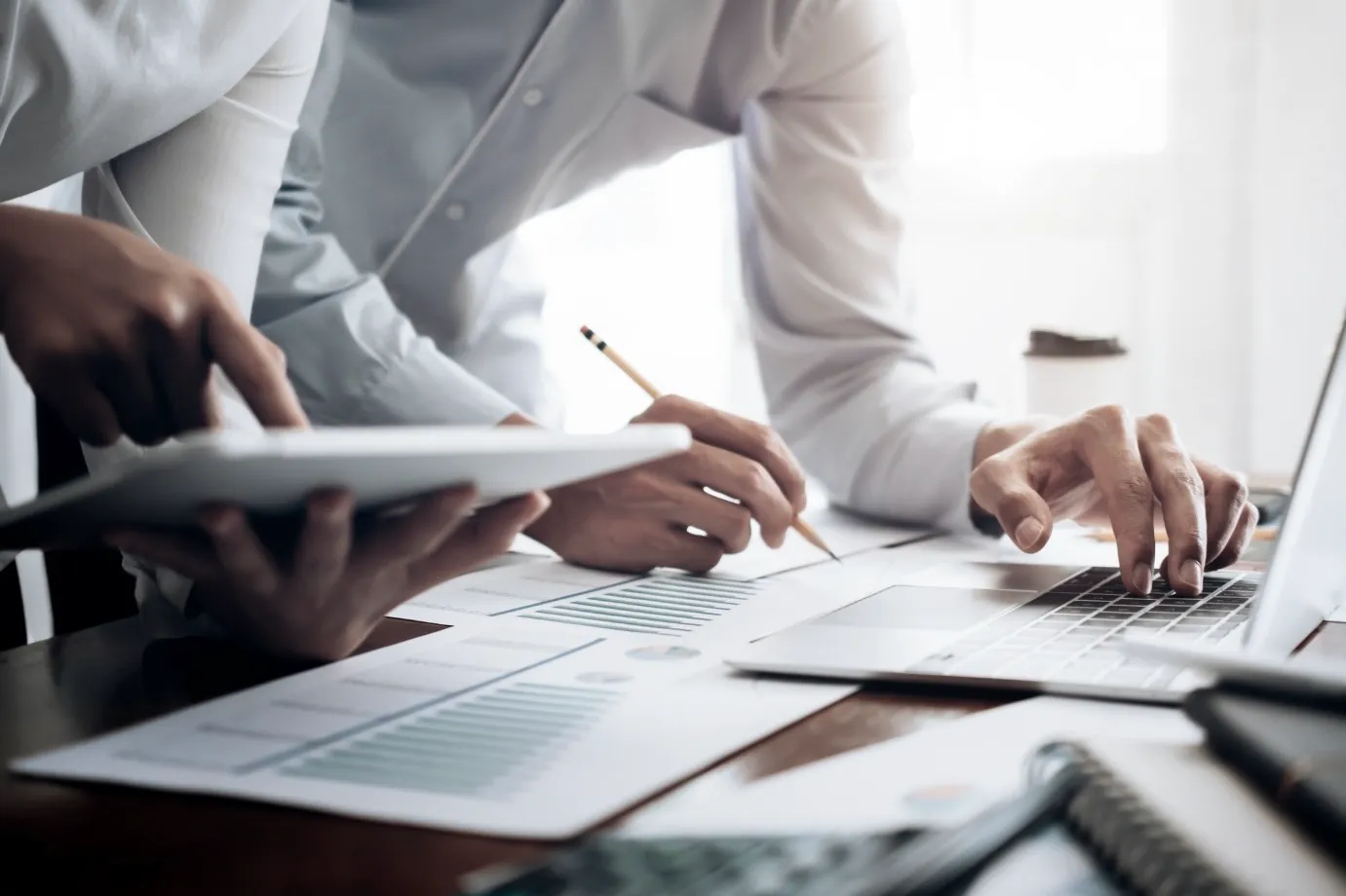 Solicitors reviewing documents together at a desk