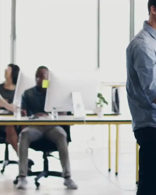 Staff working at their desks in an open-plan office