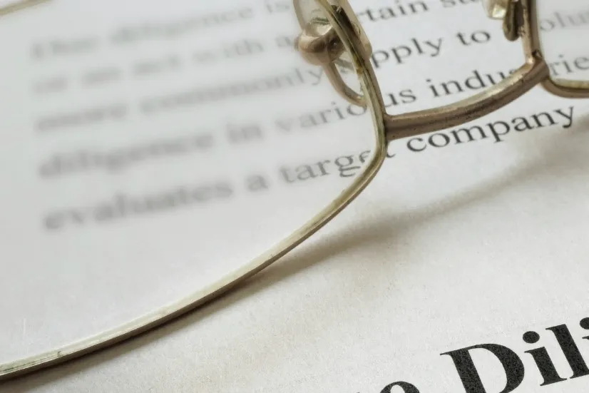 Reading glasses resting on a printed legal document